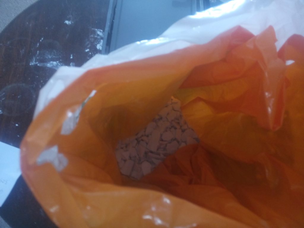 Plaster fragments inside bags